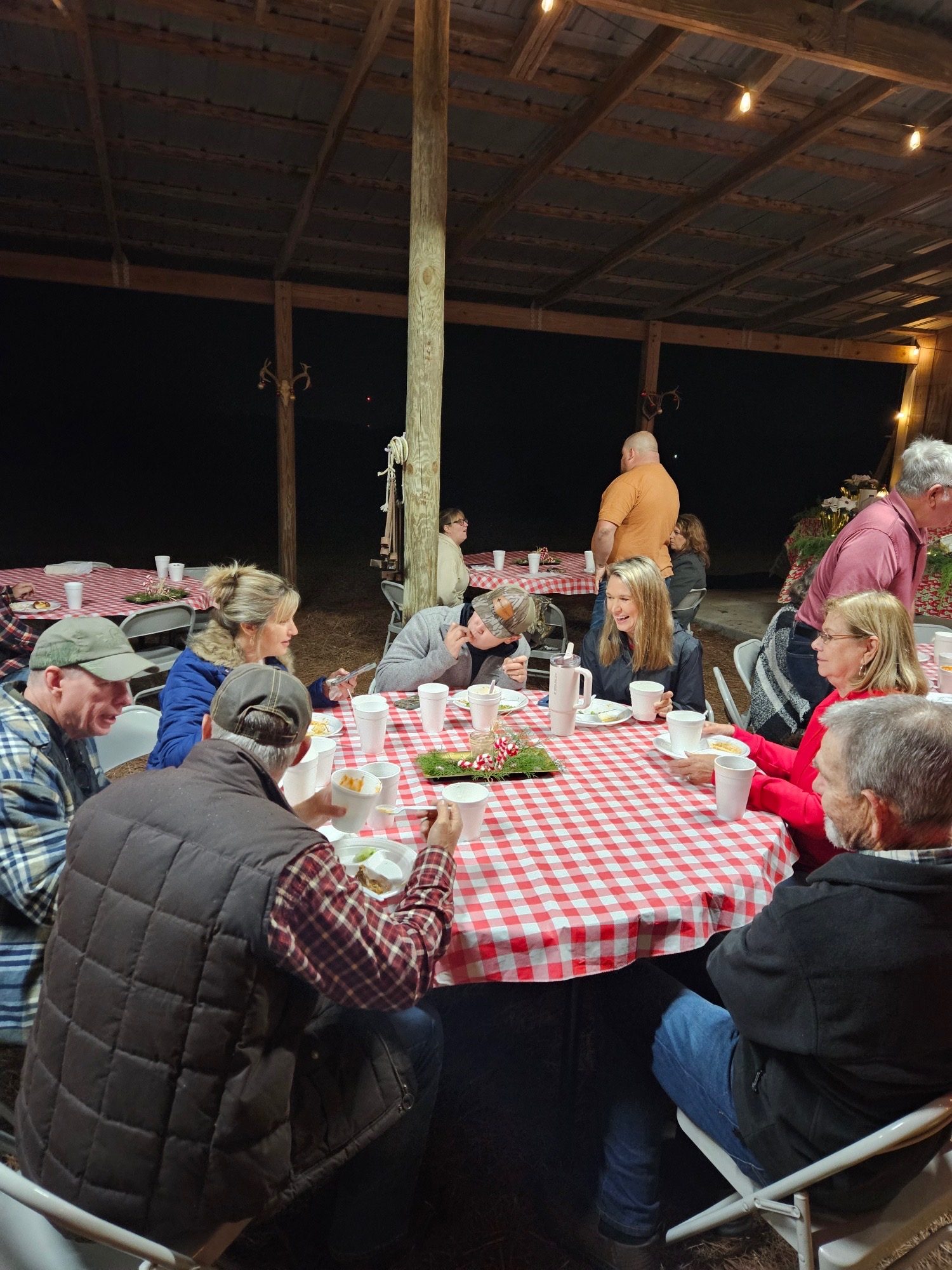 The church family sharing a meal together at an outdoor fellowship gathering
