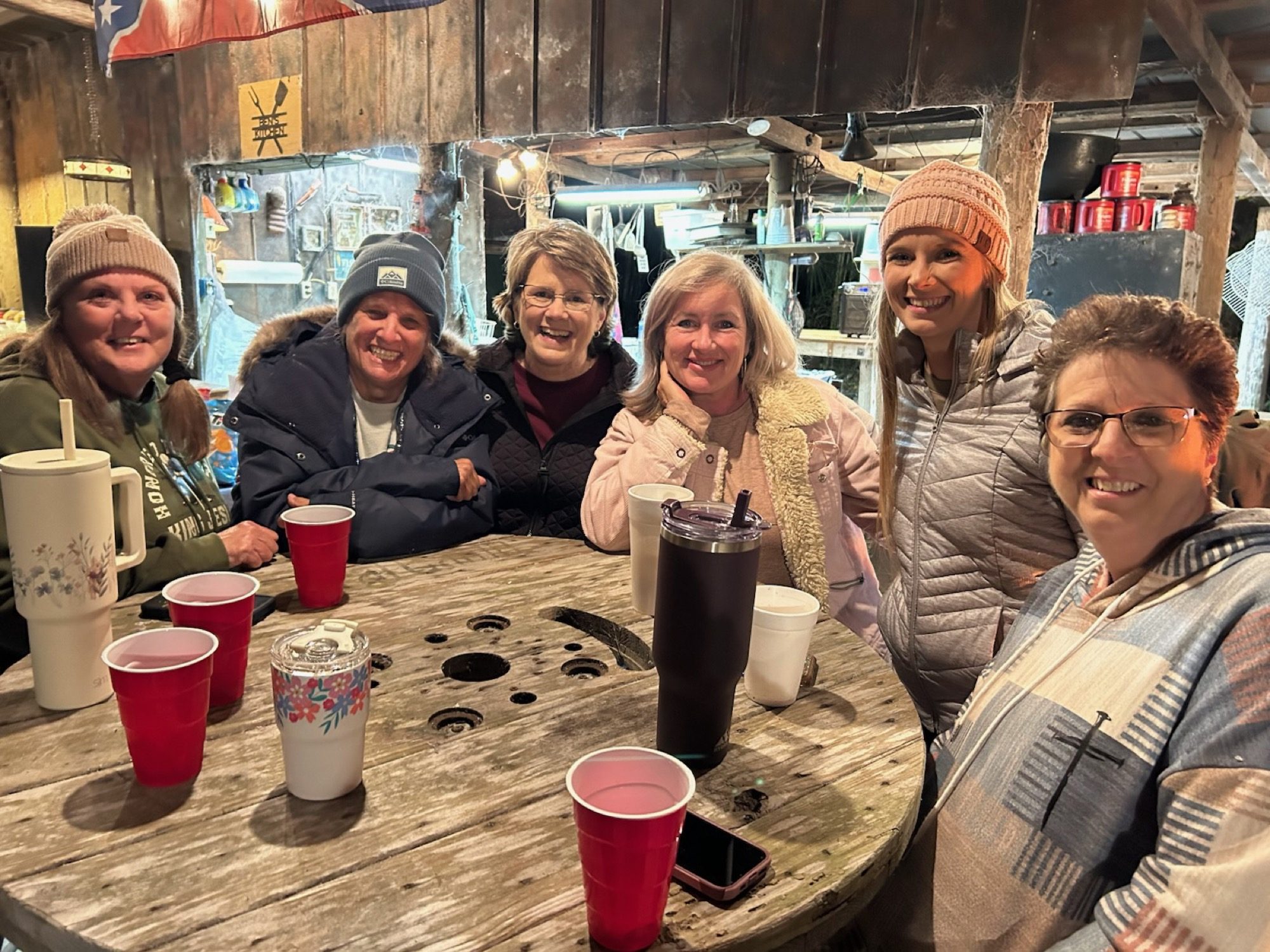 Women of the church enjoying fellowship around the table